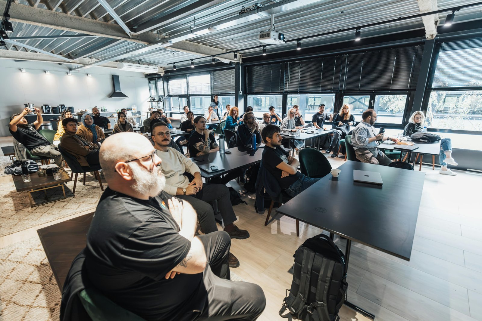 Attendees seated through a Guidon workshop session
